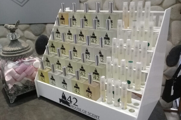 Custom designed 5-tier white perspex fragrance & sample display stand with sample trays